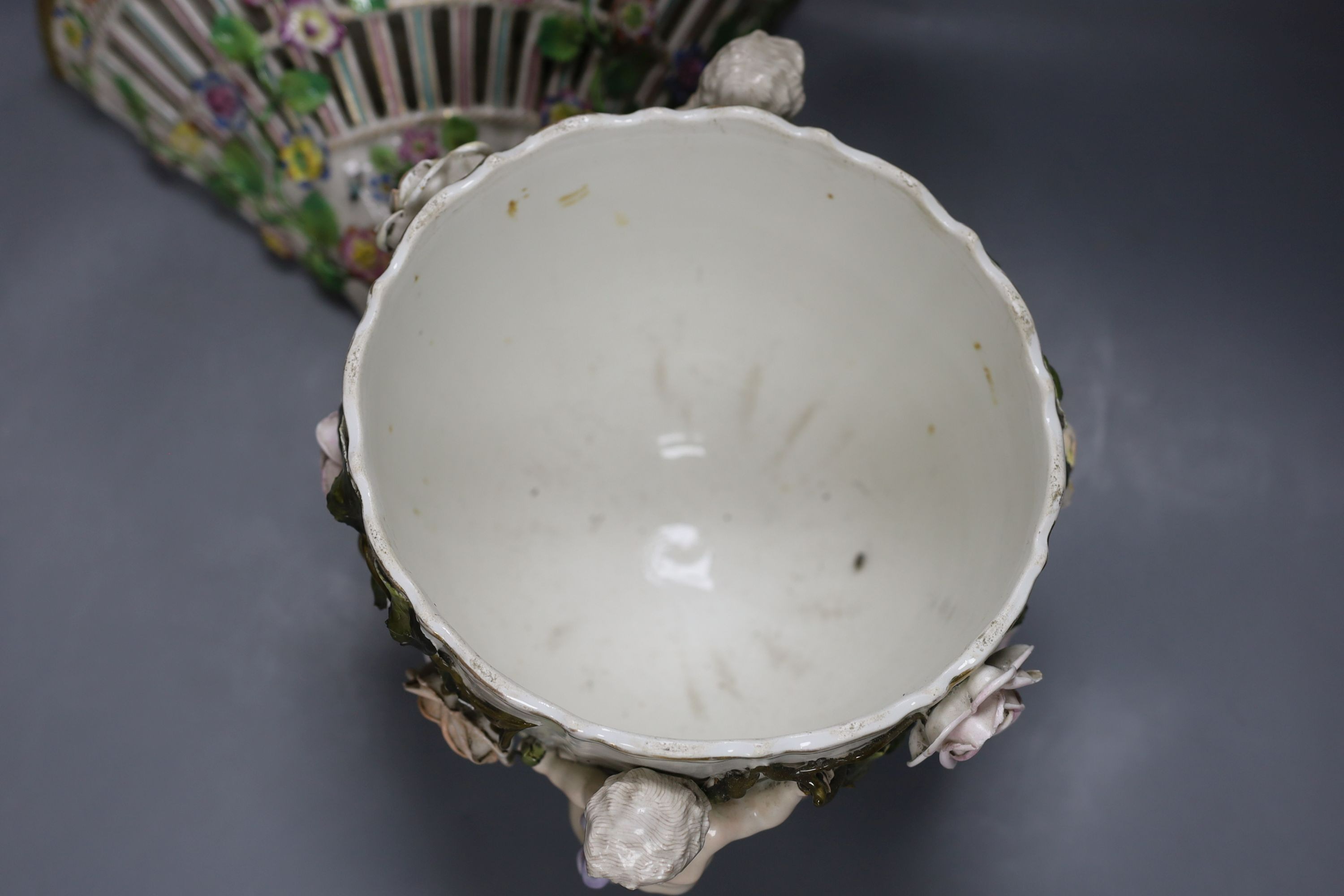 A late 19th century Sitzendorf cherub jardiniere, 18cm tall, and a porcelain floral wall bracket